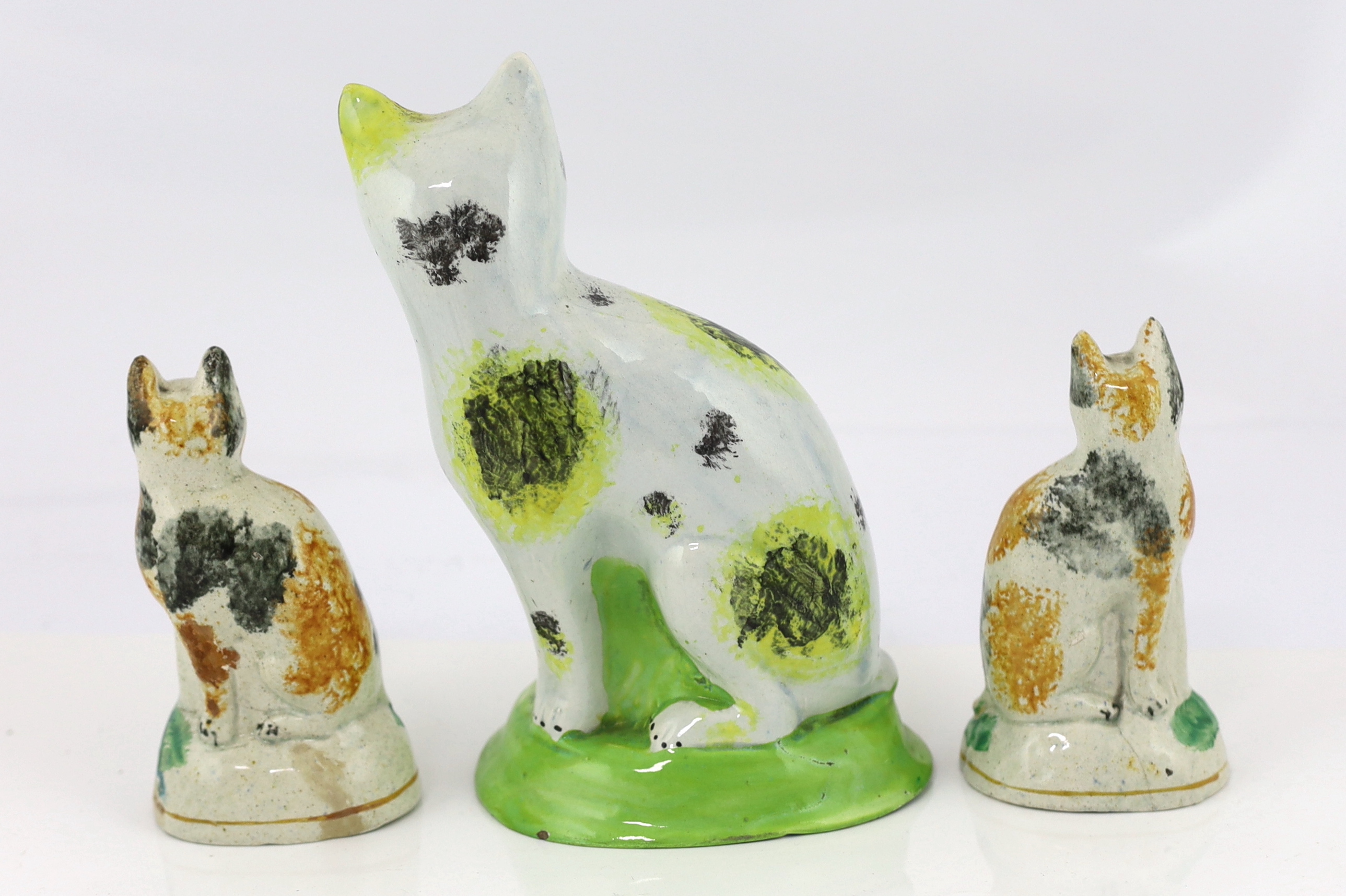 Six Staffordshire pearlware models of cats, early 19th century